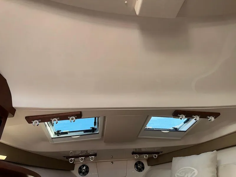 Slide: The Image of Interior cabin view of 2022 Grady-White Express 330 with skylights and modern design. - 37