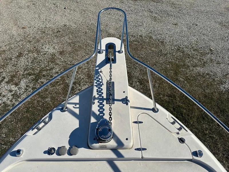 Slide: The Image of Bow view of 2022 Grady-White Express 330 boat with anchor chain and railings. - 38