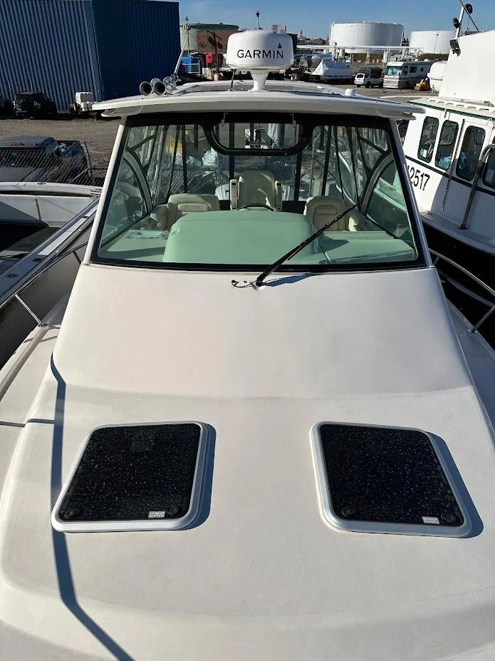 Slide: The Image of 2022 Grady-White Express 330 boat with Garmin radar, docked in a marina. - 39