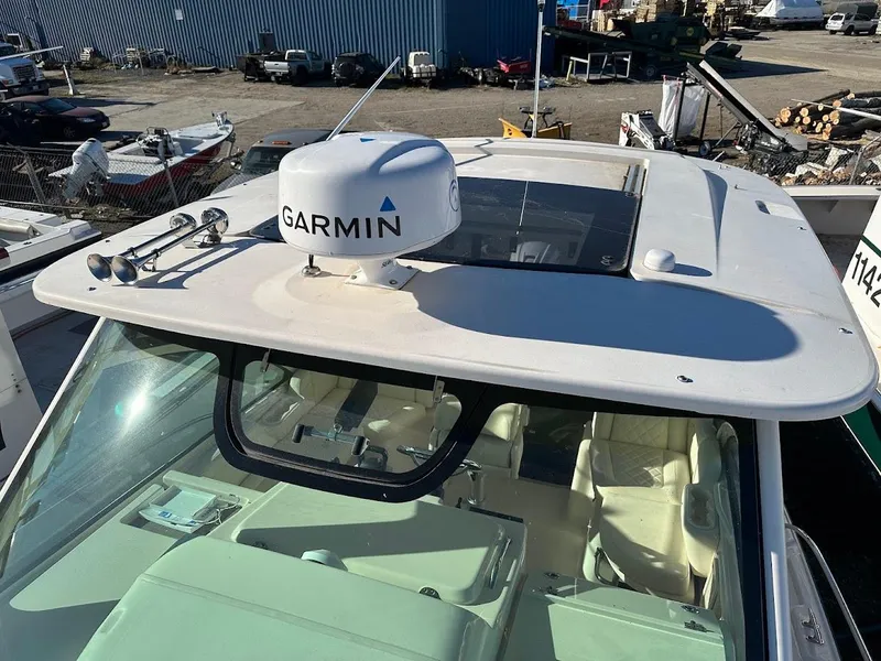Slide: The Image of 2022 Grady-White Express 330 boat with Garmin radar, docked in a marina. - 40