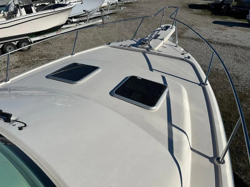 Slide: The Image of 2022 Grady-White Express 330 boat deck with hatches and railing. - 41