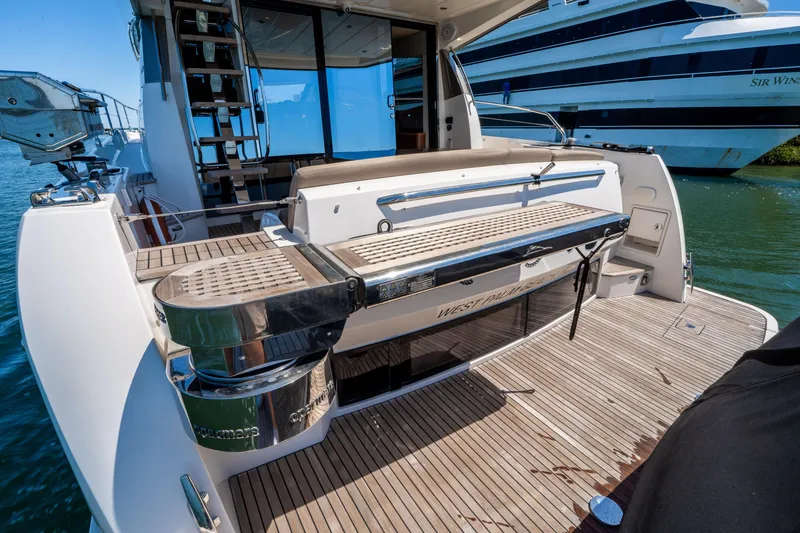 Slide: The Image of Prestige 500 Fly 2012 yacht stern with teak deck and seating area. - 10