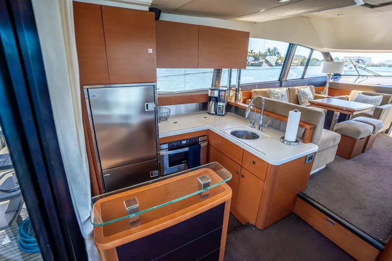 Slide: The Image of Luxurious 2012 Prestige 500 Fly yacht interior with modern kitchen and spacious seating area. - 25