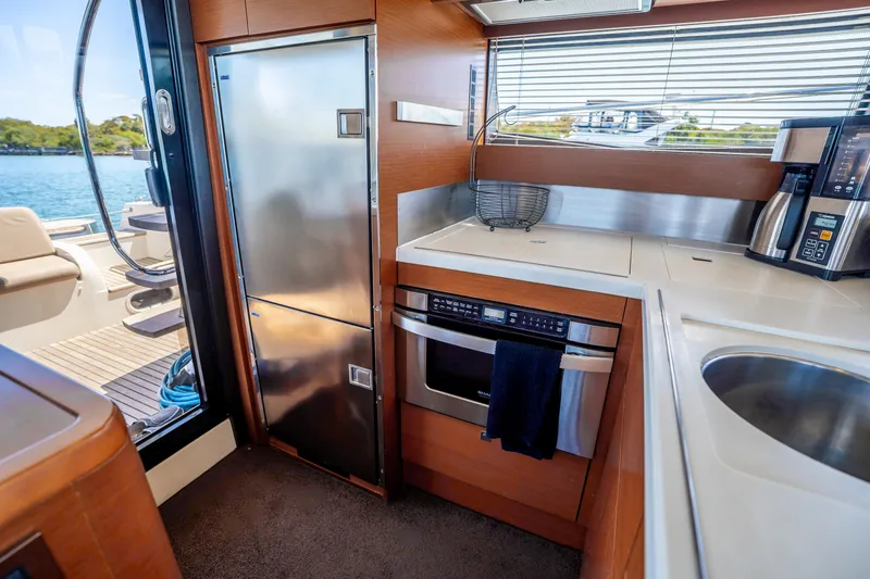 Slide: The Image of Modern kitchen interior on 2012 Prestige 500 Fly yacht with stainless steel appliances. - 27