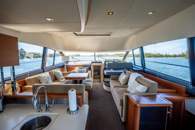 Slide: The Image of Luxurious interior of 2012 Prestige 500 Fly yacht with spacious seating and panoramic windows. - 29
