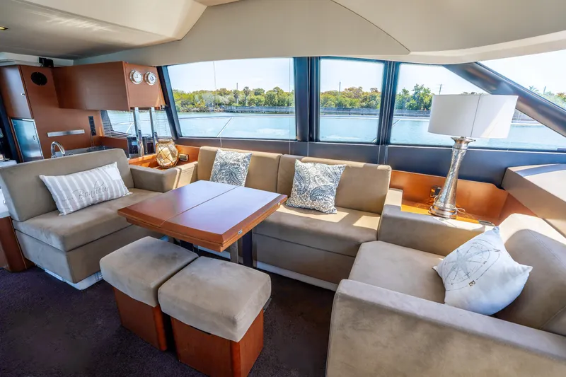 Slide: The Image of Luxurious interior of 2012 Prestige 500 Fly yacht with elegant seating and scenic window views. - 31