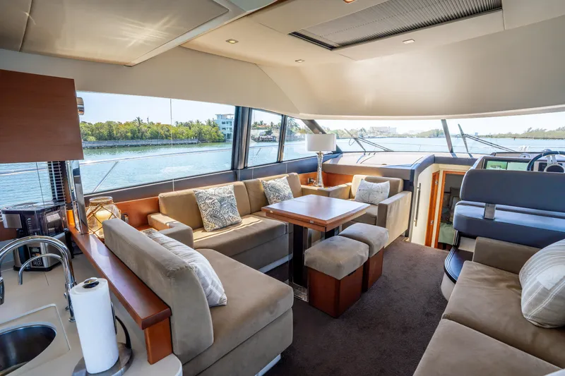 Slide: The Image of Luxurious interior of a 2012 Prestige 500 Fly yacht with plush seating and scenic views. - 32