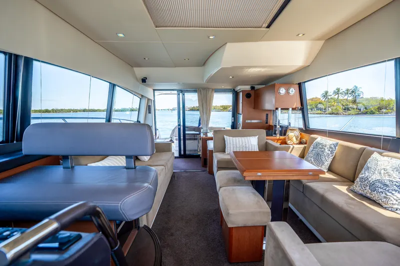 Slide: The Image of Luxurious interior of 2012 Prestige 500 Fly yacht with elegant seating and scenic views. - 33