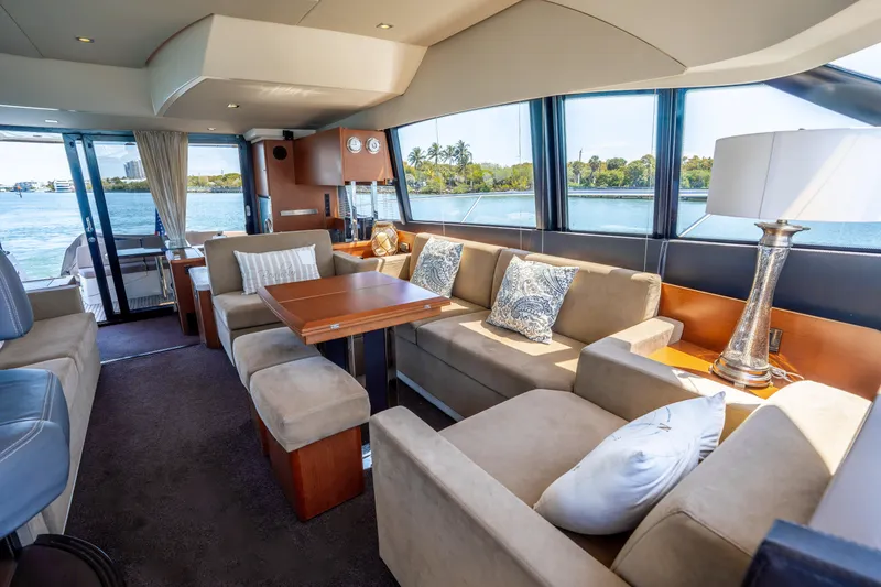 Slide: The Image of Luxurious interior of 2012 Prestige 500 Fly yacht with elegant seating and scenic water views. - 36
