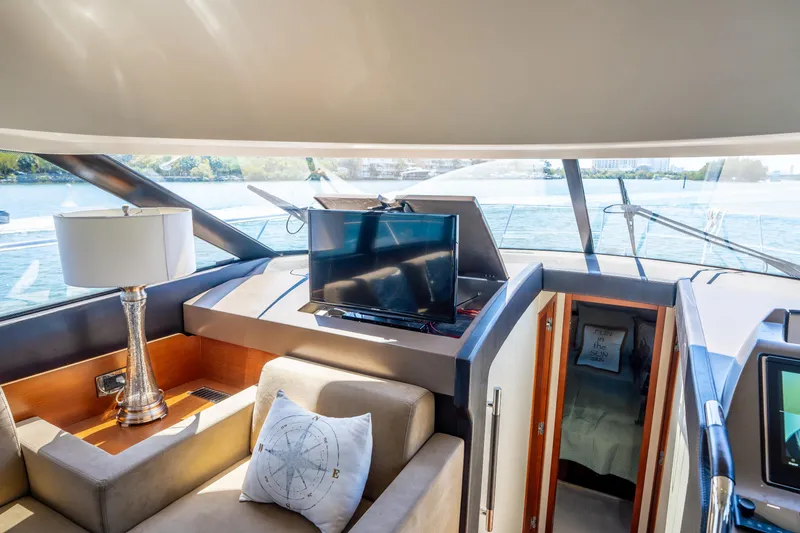 Slide: The Image of Luxurious interior of 2012 Prestige 500 Fly yacht with TV and seating area. - 37