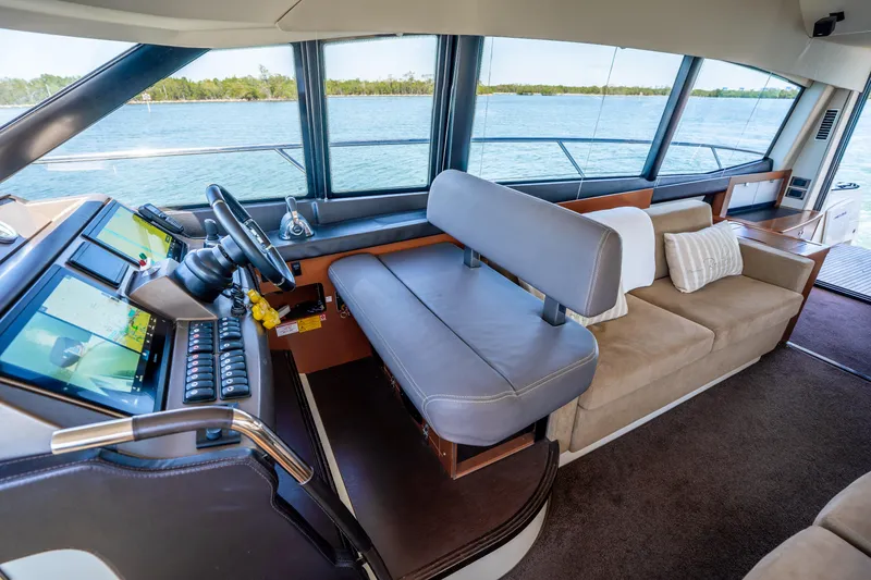 Slide: The Image of Luxurious interior of a 2012 Prestige 500 Fly yacht with modern helm and seating. - 39