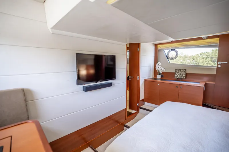 Slide: The Image of Luxurious interior of 2012 Prestige 500 Fly yacht with TV and elegant decor. - 42
