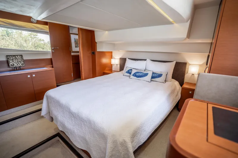 Slide: The Image of Luxurious bedroom interior of 2012 Prestige 500 Fly yacht with modern design and cozy ambiance. - 43
