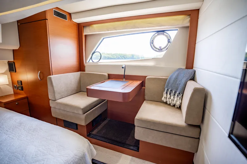 Slide: The Image of Luxurious interior of 2012 Prestige 500 Fly yacht with cozy seating and window view. - 44