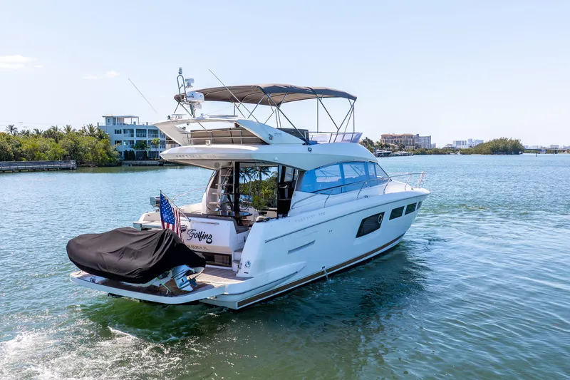 Slide: The Image of Prestige 500 Fly 2012 yacht cruising on a sunny day, surrounded by calm waters. - 6