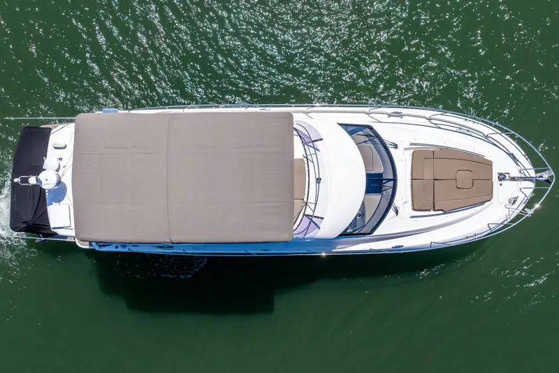 Slide: The Image of Overhead view of 2012 Prestige 500 Fly yacht on green water. - 9