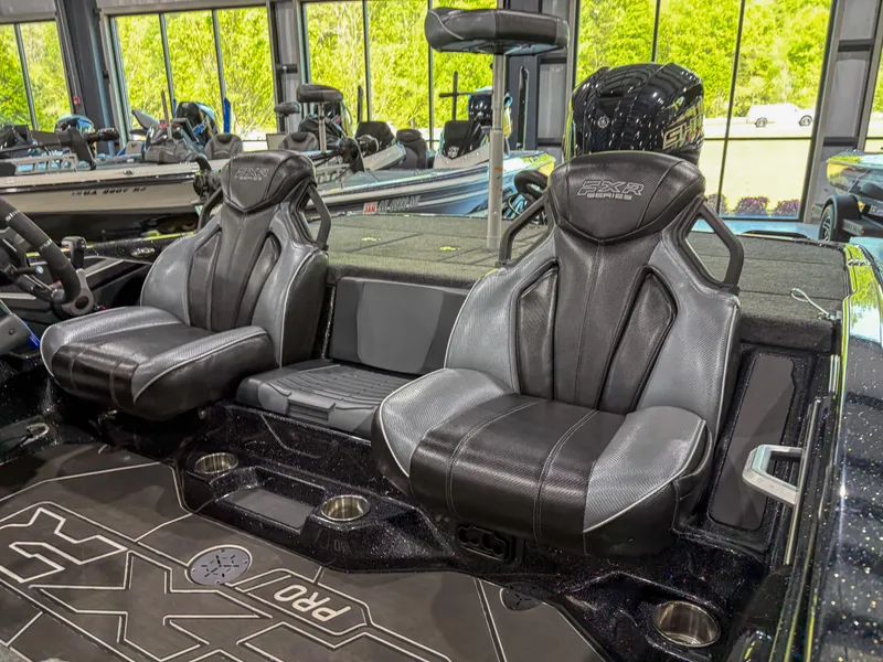 Slide: The Image of 2025 Skeeter FXR 20 boat interior with sleek black seats and modern design. - 10