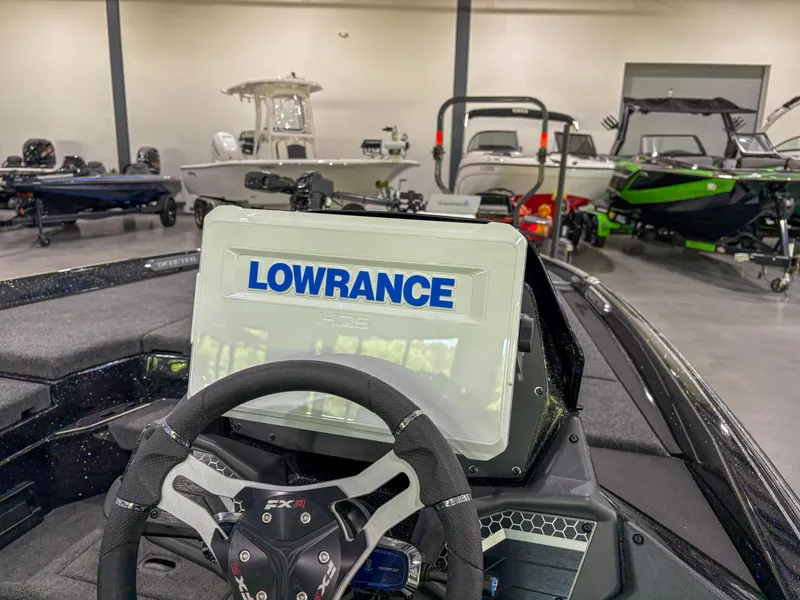 Slide: The Image of 2025 Skeeter FXR 20 boat with Lowrance navigation system in showroom. - 12