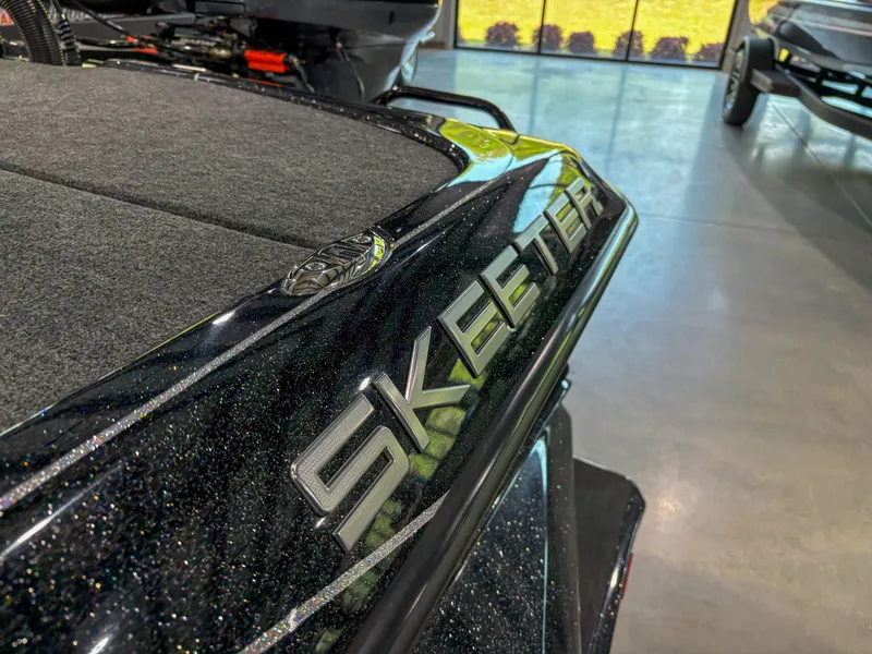 Slide: The Image of 2025 Skeeter FXR 20 boat with sleek design in showroom. - 3