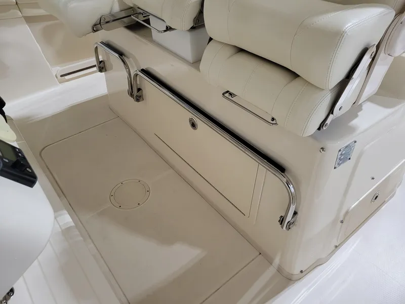 Slide: The Image of 2019 Grady-White Canyon 336 boat interior with cushioned seating and stainless steel railings. - 18