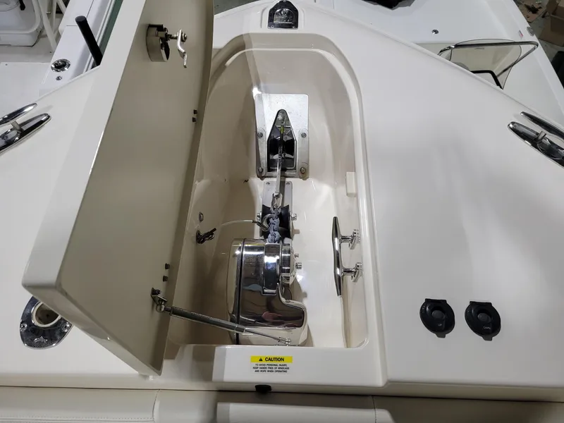 Slide: The Image of 2019 Grady-White Canyon 336 anchor locker with open hatch and winch system. - 28