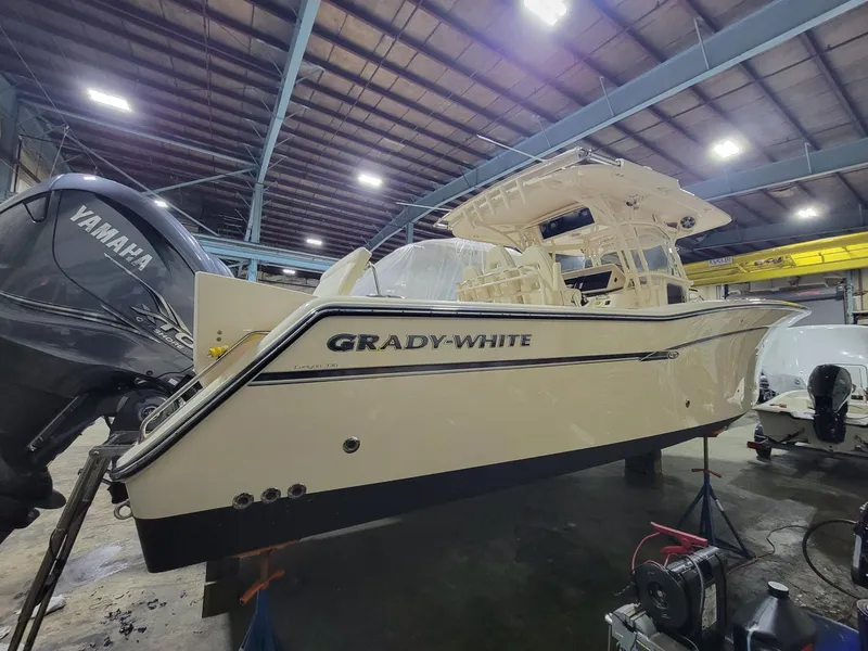 Slide: The Image of 2019 Grady-White Canyon 336 boat in a warehouse with Yamaha engines. - 4