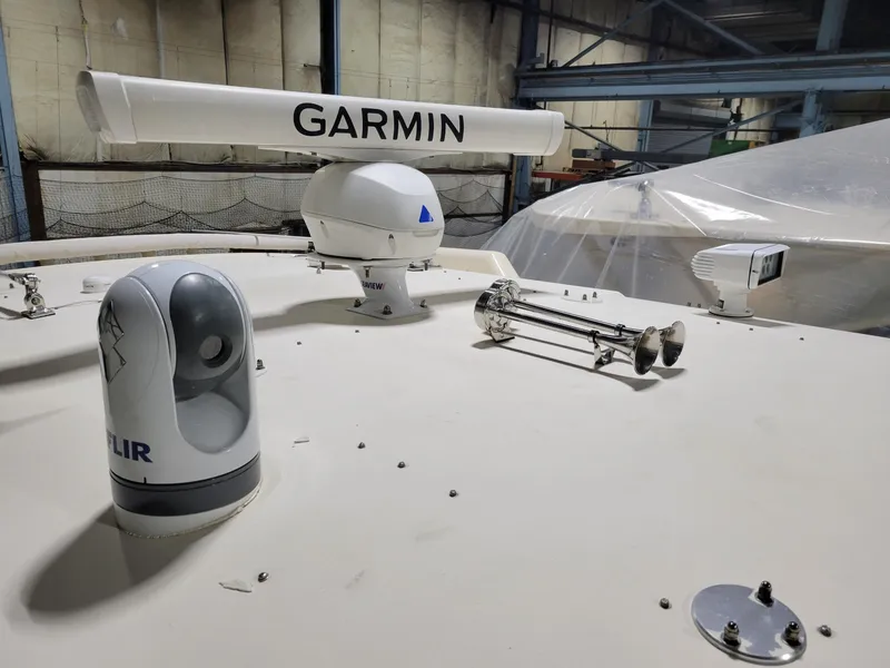 Slide: The Image of 2019 Grady-White Canyon 336 boat with Garmin radar and FLIR camera in a storage facility. - 40