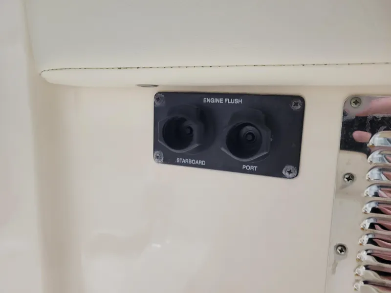 Slide: The Image of Engine flush ports on 2019 Grady-White Canyon 336 boat, labeled starboard and port. - 42