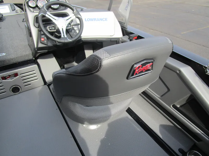 Slide: The Image of 2024 Ranger 621 CUP boat interior with steering wheel and branded seat. - 5