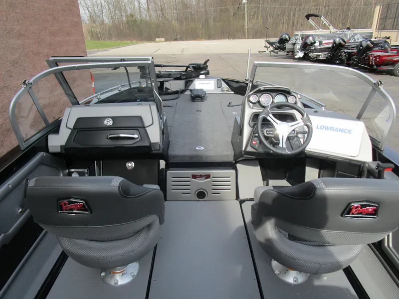 Slide: The Image of 2024 Ranger 621 CUP boat interior with dual seats and steering console. - 6