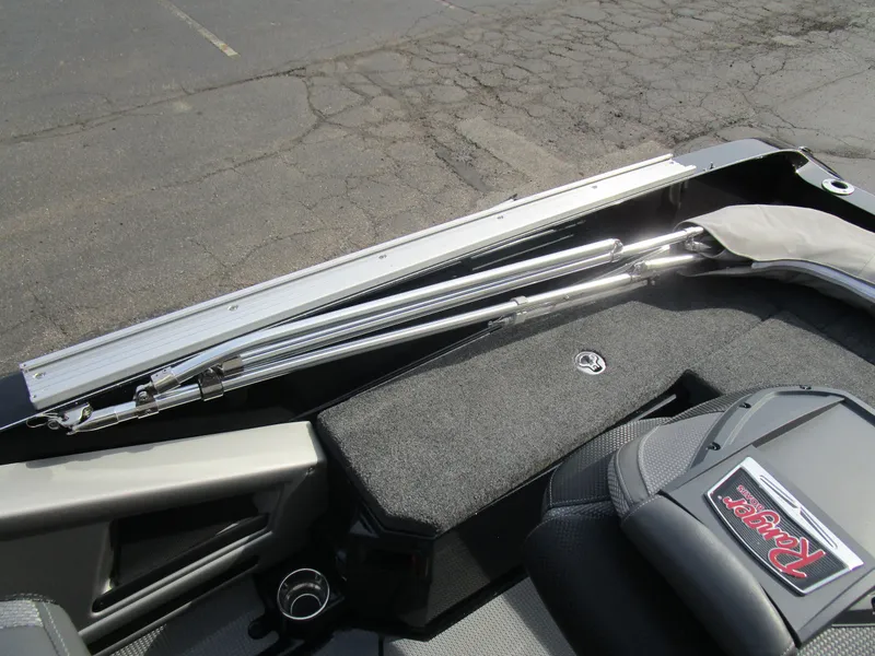 Slide: The Image of 2024 Ranger 621 CUP boat interior with storage compartment and seating. - 8