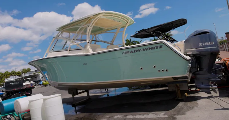 Slide: The Image of 2018 Grady-White Freedom 307 boat with Yamaha engine on a sunny day. - 0
