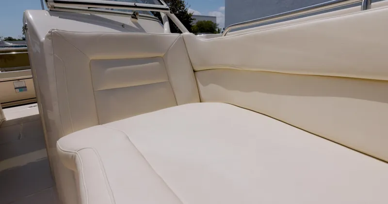 Slide: The Image of 2018 Grady-White Freedom 307 boat interior with cream-colored seating. - 11