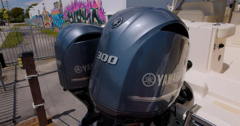 Slide: The Image of Twin Yamaha 300 engines on a 2018 Grady-White Freedom 307 boat, with colorful graffiti background. - 17