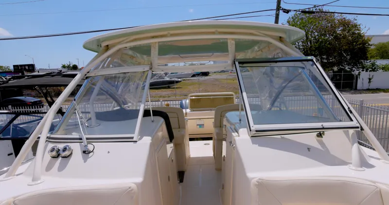 Slide: The Image of 2018 Grady-White Freedom 307 boat with open cockpit and dual consoles. - 2