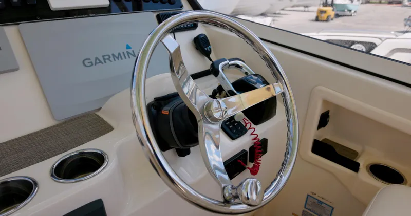 Slide: The Image of Steering wheel of 2018 Grady-White Freedom 307 boat with Garmin navigation system. - 4