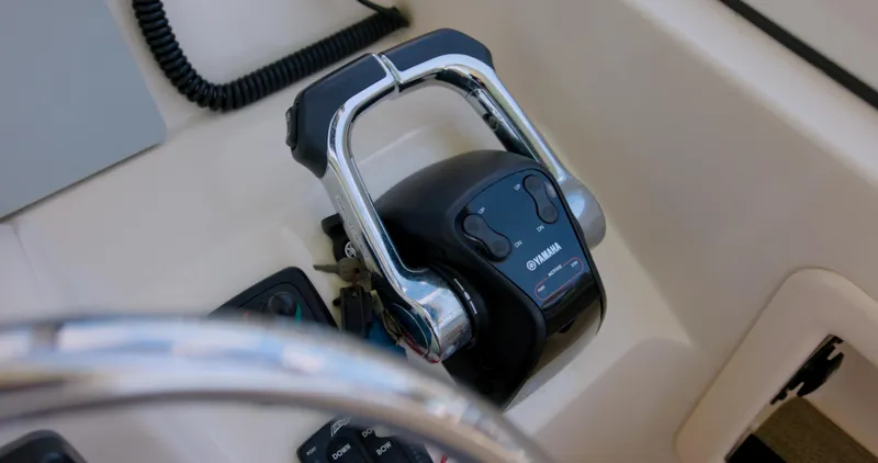 Slide: The Image of Throttle control on 2018 Grady-White Freedom 307 boat dashboard. - 5