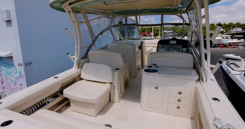 Slide: The Image of 2018 Grady-White Freedom 307 boat interior with seating and storage compartments. - 7