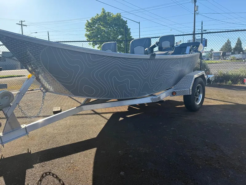 Slide: The Image of 2025 Driftwood Boats Drifter 18.5 on trailer, featuring sleek design and modern detailing. - 1