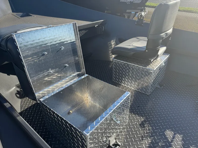 Slide: The Image of Interior of 2025 Driftwood Boats Drifter 18.5 with metal storage and seating. - 12