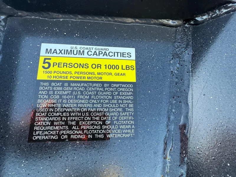Slide: The Image of U.S. Coast Guard capacity label on Driftwood Boats Drifter 18.5, 2025 model, showing limits and safety instructions. - 15