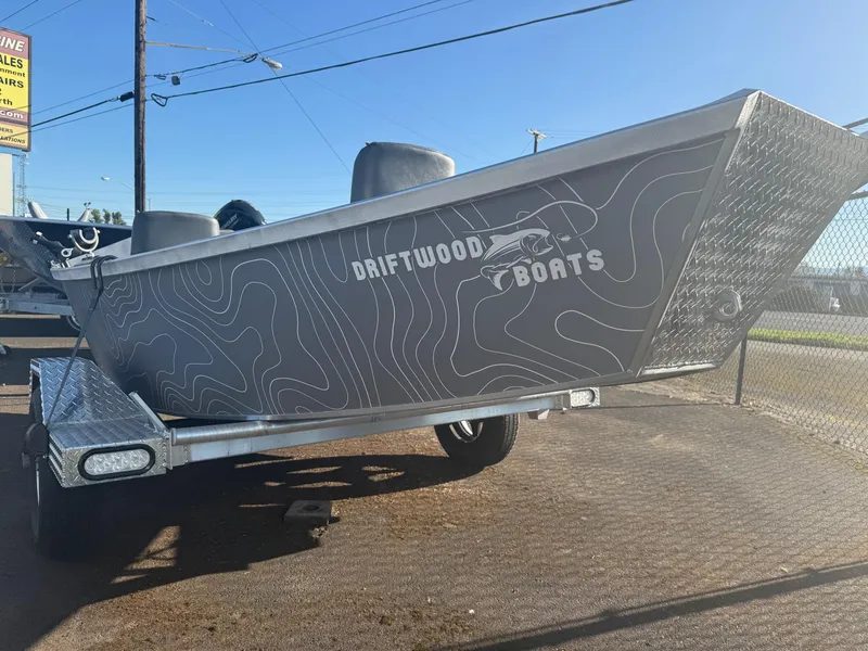 Slide: The Image of 2025 Custom Driftwood Boats Drifter 18.5 on trailer, featuring sleek design and modern graphics. - 3
