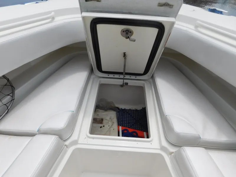 Slide: The Image of 2013 Hydra-Sports 4200 Siesta boat storage compartment with open hatch and visible interior. - 14