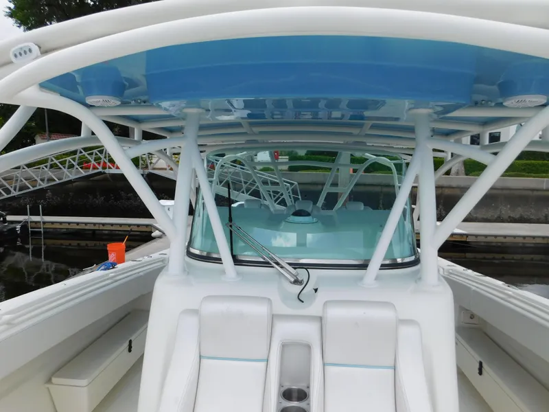 Slide: The Image of 2013 Hydra-Sports 4200 Siesta boat interior with seating and blue canopy. - 18