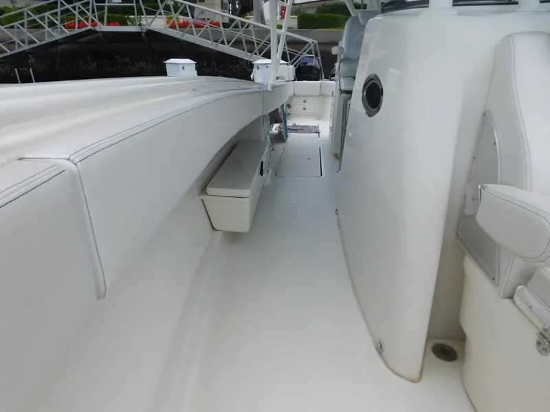 Slide: The Image of 2013 Hydra-Sports 4200 Siesta boat interior with white seating and sleek design. - 27
