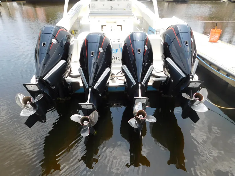 Slide: The Image of 2013 Hydra-Sports 4200 Siesta with four powerful outboard engines on water. - 4
