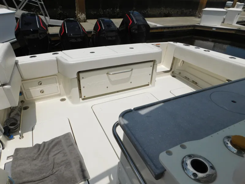 Slide: The Image of 2013 Hydra-Sports 4200 Siesta boat interior with seating and storage compartments. - 47