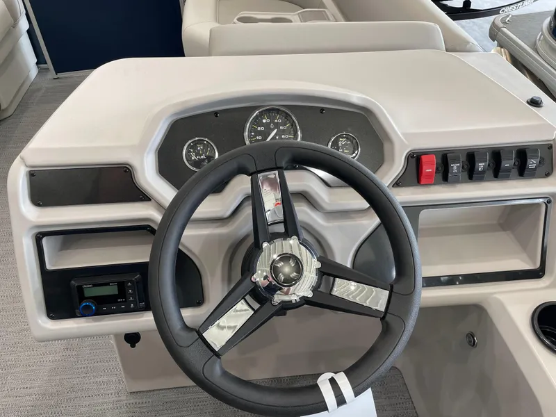 Slide: The Image of Steering console of 2025 Godfrey EX2086SBX boat with gauges and controls. - 10