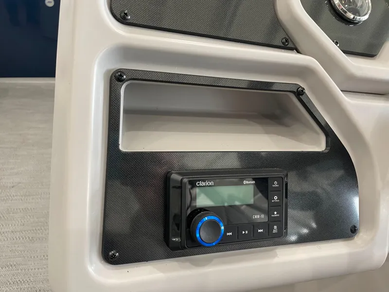 Slide: The Image of 2025 Godfrey EX2086SBX dashboard with Clarion Bluetooth stereo system. - 12