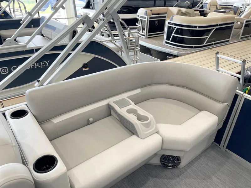 Slide: The Image of Luxurious seating on 2025 Godfrey EX2086SBX boat, featuring cup holders and modern design. - 15